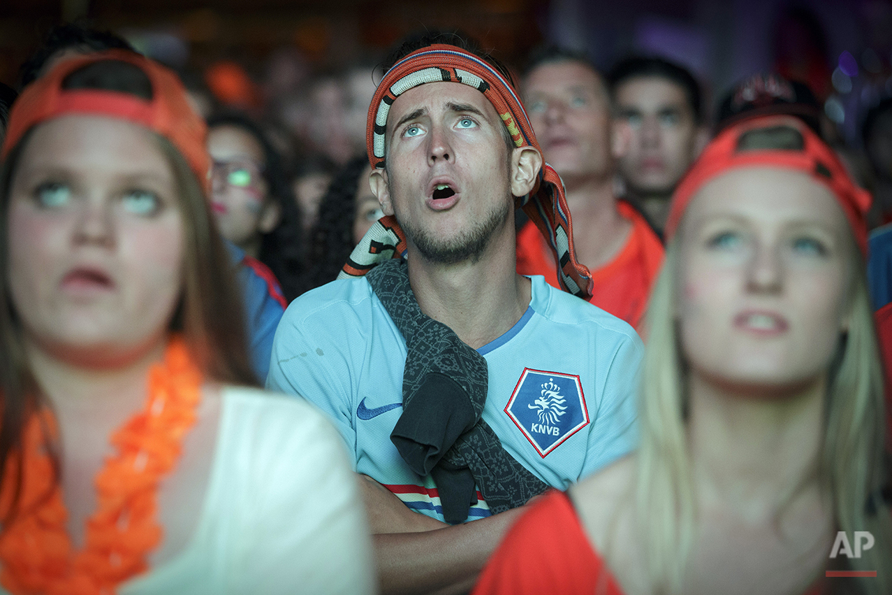  Soccer fans watch a live broadcast of the FIFA World Cup semifinal soccer match between Netherlands and Argentina on a giant screen in the center of Eindhoven, Netherlands, Wednesday, July 9, 2014. (AP Photo/Phil Nijhuis) 