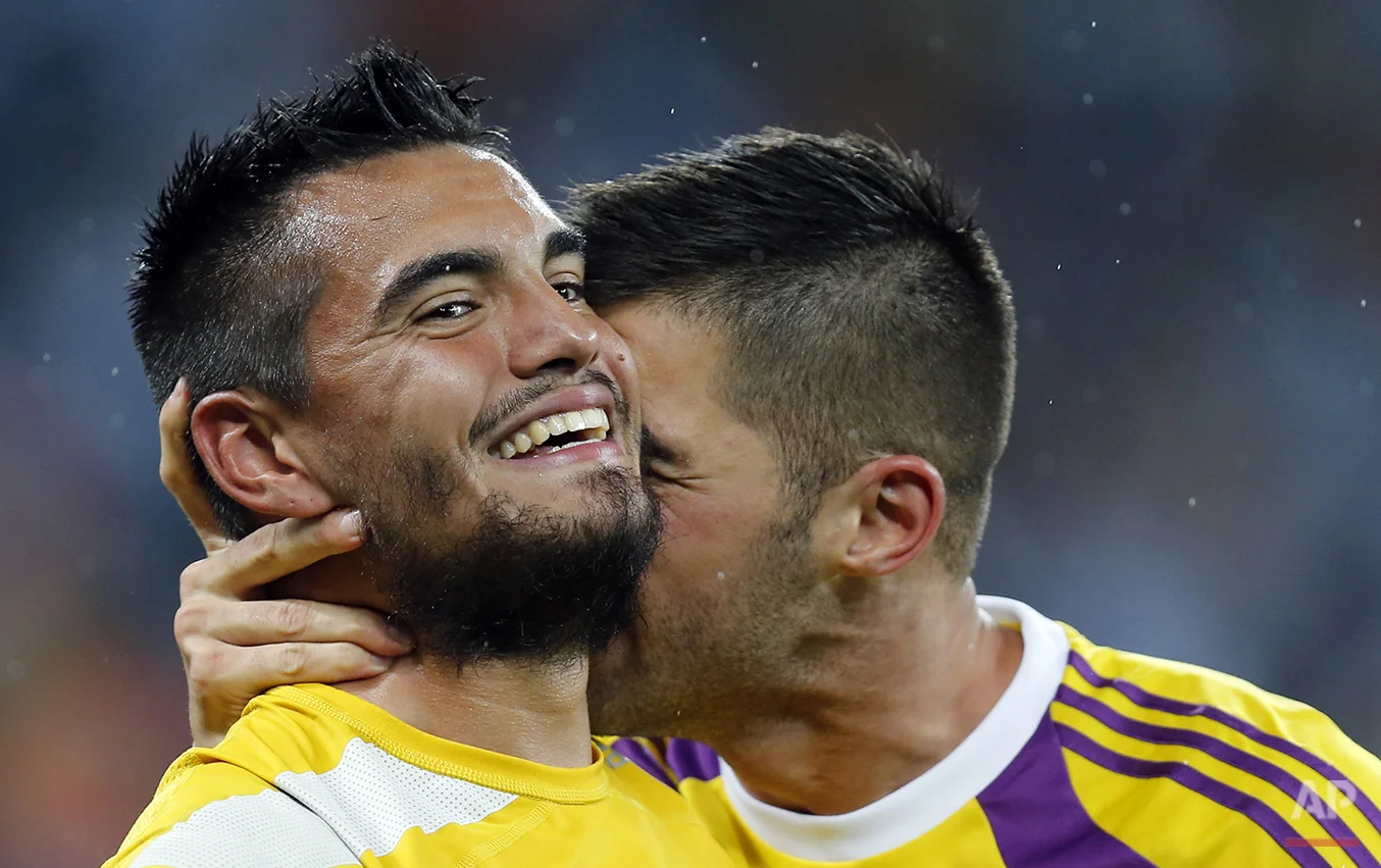 Argentina's goalkeeper Mariano Andujar, right, congratulates goalkeeper Sergio Romero after the World Cup semifinal soccer match between the Netherlands and Argentina at the Itaquerao Stadium in Sao Paulo, Brazil, Wednesday, July 9, 2014. Argentina beat the Netherlands 4-2 in a penalty shootout to reach the World Cup final. (AP Photo/Frank Augstein)
