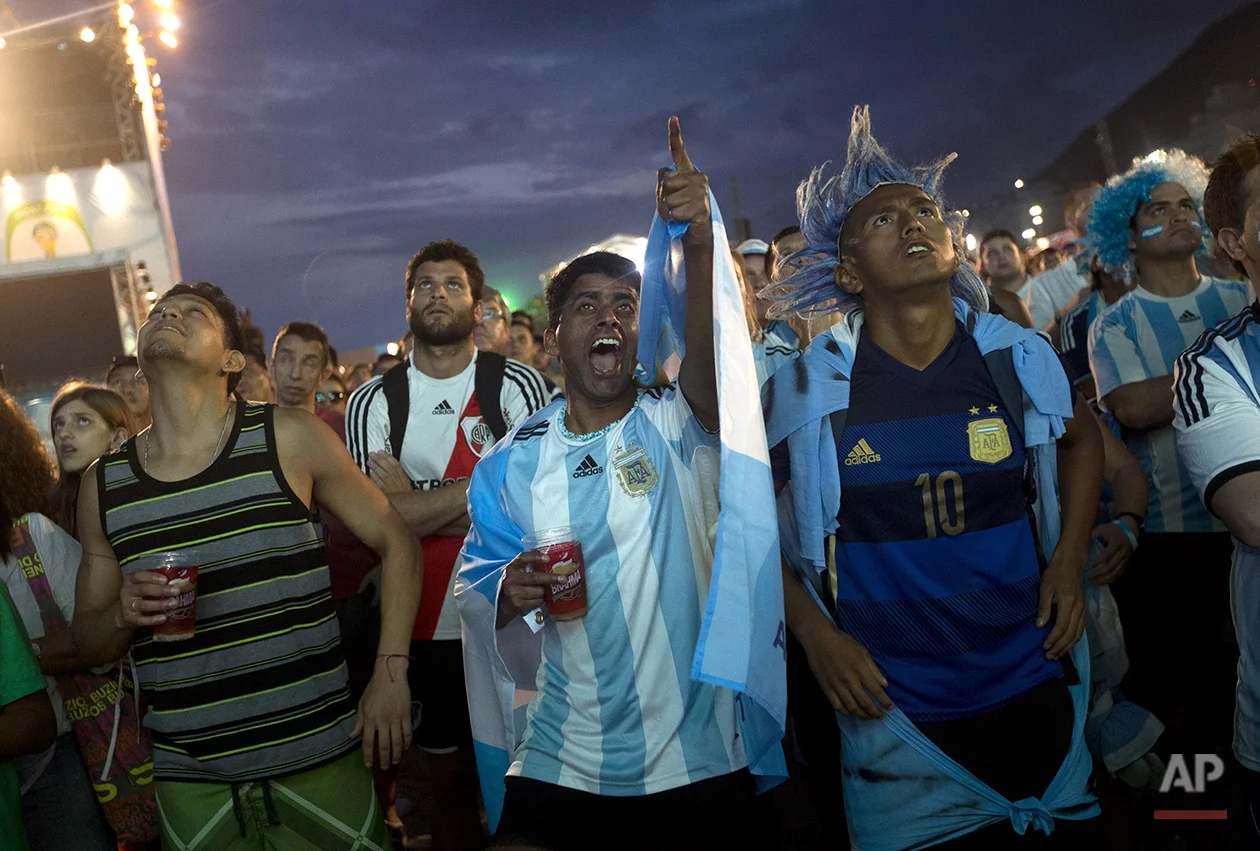 Argentina soccer fans watch a live broadcast of their team's World Cup semifinal match against Netherlands inside the FIFA Fan Fest area on Copacabana beach in Rio de Janeiro, Brazil, Wednesday, July 9, 2014. (AP Photo/Silvia Izquierdo)