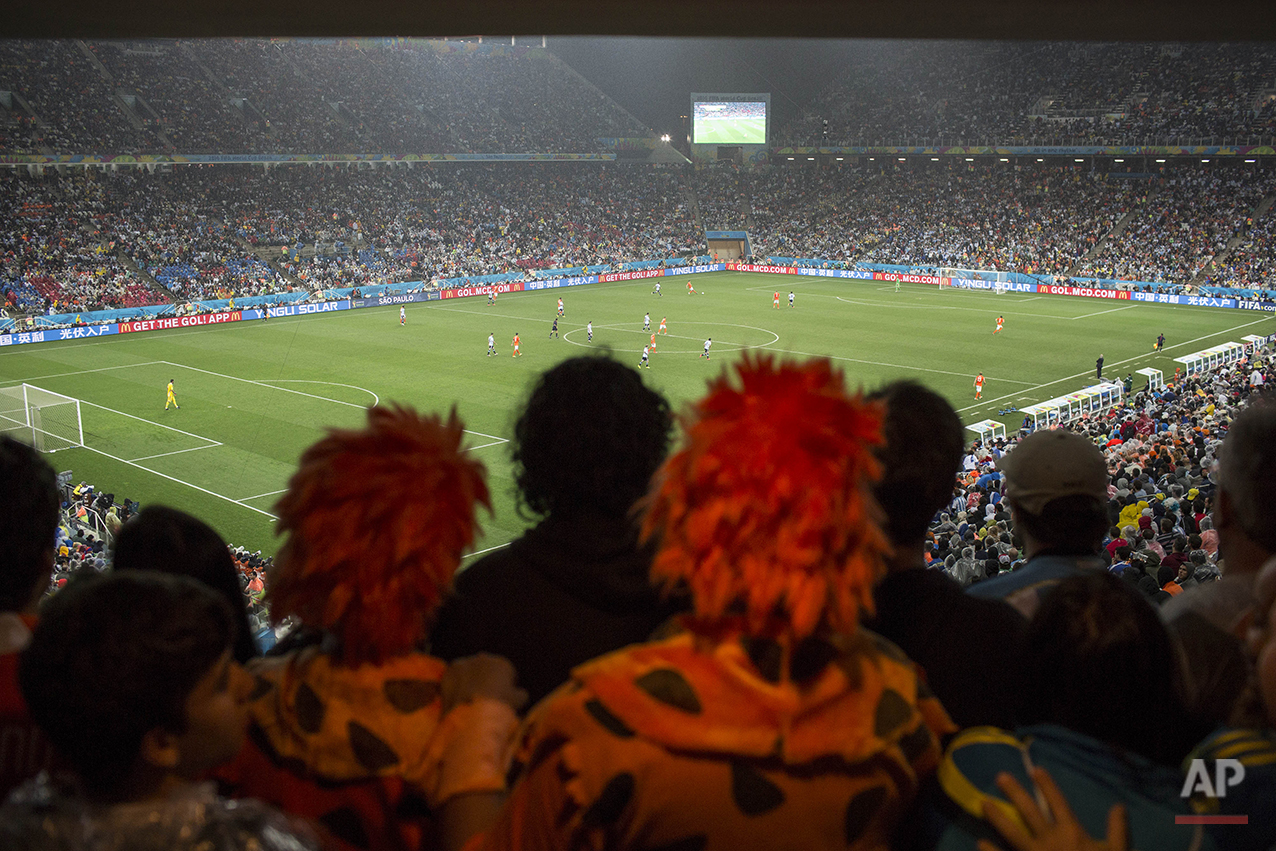  Fans watch the World Cup semifinal soccer match between the Netherlands and Argentina at the Itaquerao Stadium in Sao Paulo Brazil, Wednesday, July 9, 2014.  Argentina reached the World Cup final on Wednesday after beating the Netherlands 4-2 in a p