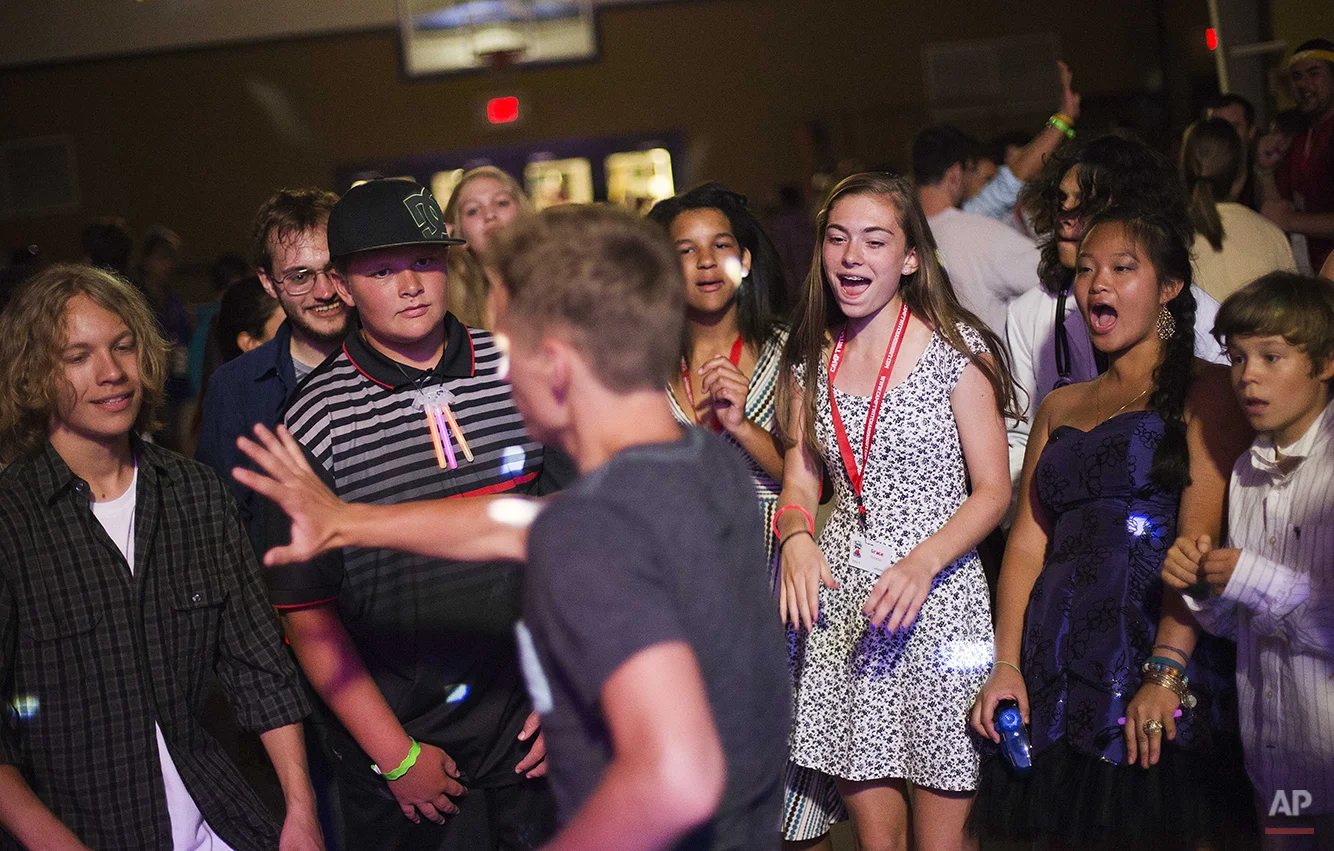 In this Thursday, July 17, 2014 photo, campers attend a dance on the final evening at Camp Twitch and Shout, a camp for children with Tourette's Syndrome in Winder, Ga. (AP Photo/David Goldman)