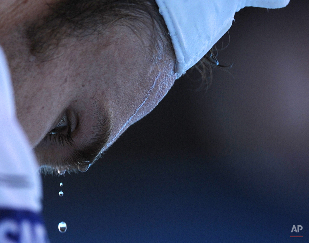  Beads of sweat drip from the forehead of Andy Roddick of the United States during a break in his game against Marin Cilic of Croatia during their Men's singles quarterfinal match at the Australian Open tennis championship in Melbourne, Australia, Mo