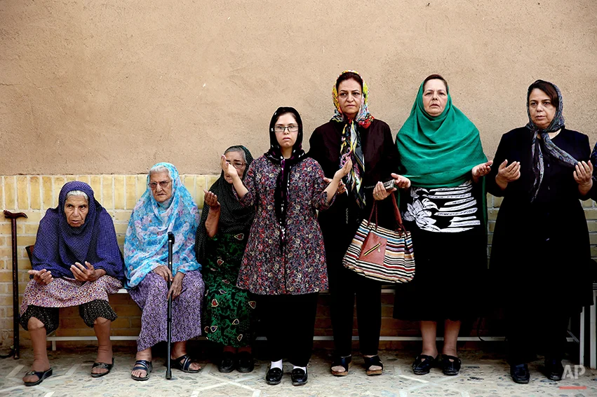 In this Saturday, June 14, 2014 photo, Zoroastrians pray in Setipir Shrine in Yazd about 405 miles (675 kilometers) southeast of the capital Tehran, Iran. Zoroastrianism is a monotheistic religion predating Christianity, Islam and Judaism, founded some 3,800 years ago by the prophet Zoroaster. It was the dominant religion in Persia before the Arab conquest. Thousands of Zoroastrians, like many other Iranians, immigrated abroad under former president Mahmoud Ahmadinejad because of social restrictions and a worsening economy. But now a dozen have returned to live in Iran this past year, the government said. (AP Photo/Ebrahim Noroozi)
