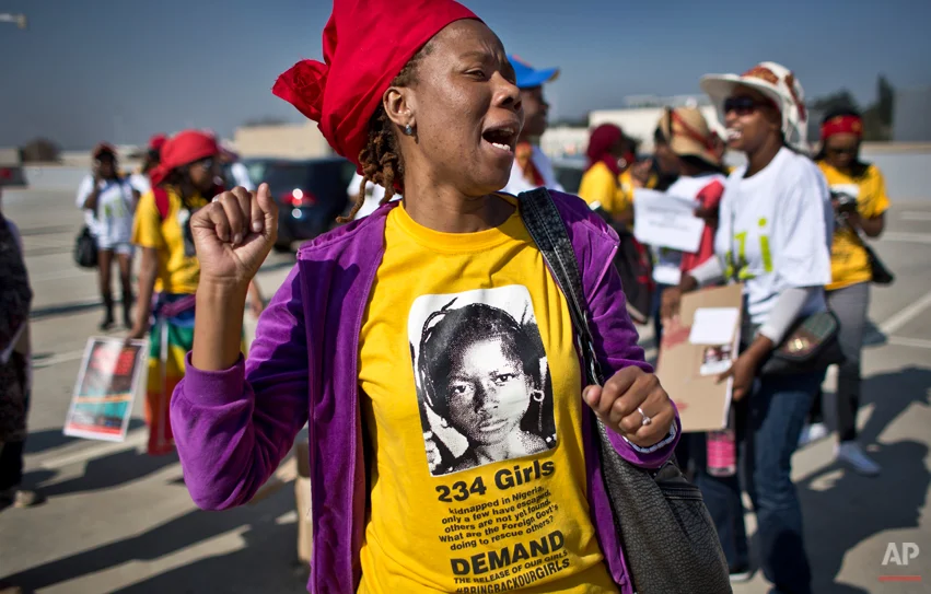 South Africans protest in solidarity against the abduction three weeks ago of hundreds of schoolgirls in Nigeria by the Muslim extremist group Boko Haram and what protesters said was the failure of the Nigerian government and international community to rescue them, during a march to the Nigerian Consulate in Johannesburg, South Africa Thursday, May 8, 2014. The kidnapping has ignited a viral social media campaign that has brought renewed attention to Boko Haram's campaign of violence, and protests around the world. (AP Photo/Ben Curtis)