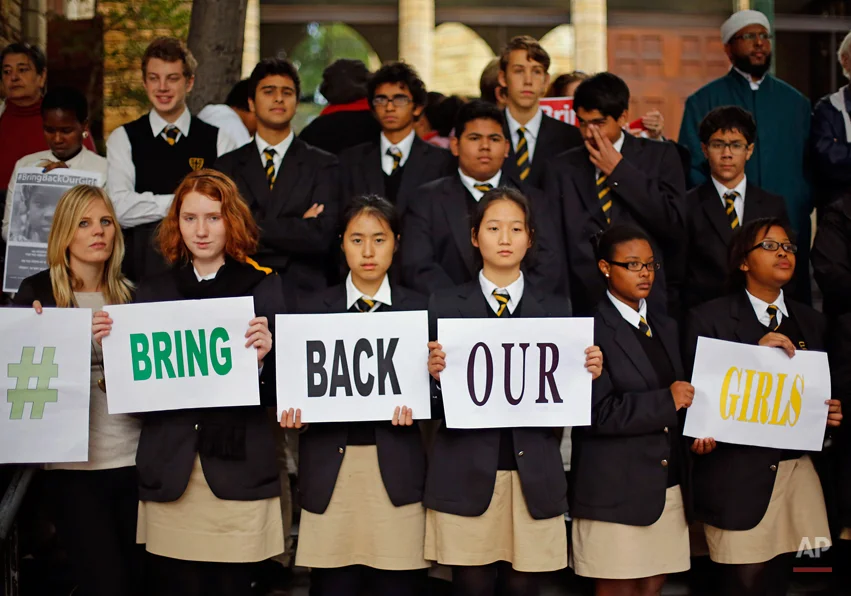 South African school children and religious leaders take part in a silent protest in support of the kidnapped school girls from Chibok Secondary school in Abuja, Nigeria, that were abducted a month ago, in Cape Town, South Africa, Friday, May 16, 2014. Amid apparent security concerns, Nigerian President Goodluck Jonathan has cancelled a trip to the traumatized town from which Islamic extremists abducted more than 300 schoolgirls a month ago. Two officials in the presidency confirmed the cancellation on Friday. (AP Photo/Schalk van Zuydam)