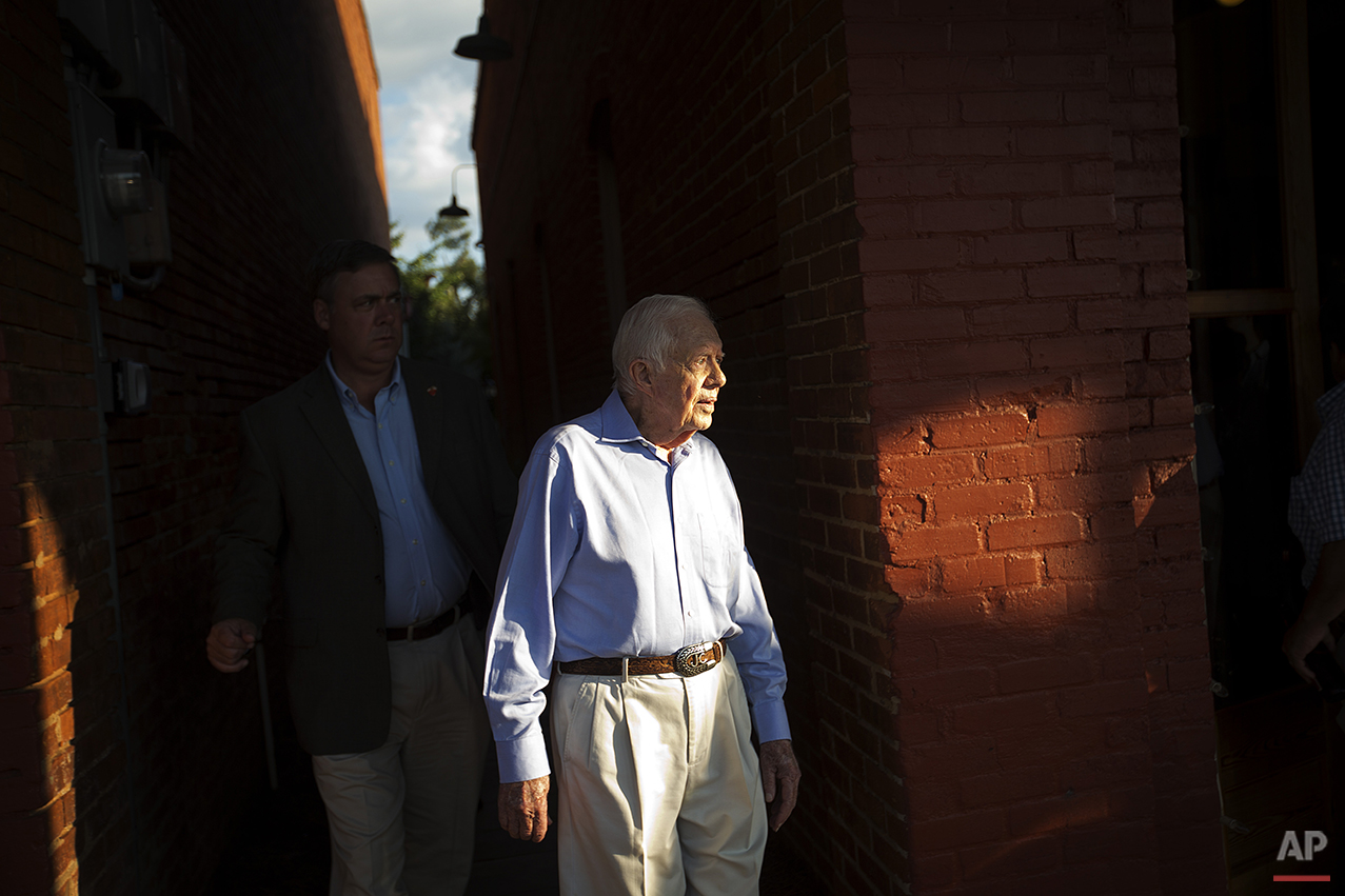  Former President Jimmy Carter leaves a reception in his hometown of Plains, Ga., Saturday, Aug. 22, 2015. As Carter undergoes treatment for cancer that has spread to his brain, the town of less than 800 people is ready to support him. Friends say th