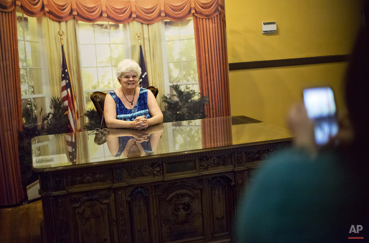  Jane Gurley, of Hendersonville, N.C., has her photo taken at a mock Oval Office while visiting the hometown of former President Jimmy Carter in Plains, Ga., Saturday, Aug. 22, 2015. "He was the first President I voted for," said Gurley. "It has spec