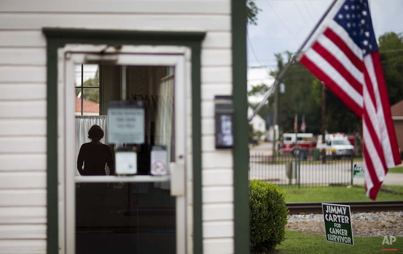 A visitor walks through an old train depot that became a local campaign office for former President Jimmy Carter in his hometown in Plains, Ga., Sunday, Aug. 23, 2015. Carter’s 1976 election to the presidency made Plains a tourist destination. Main 