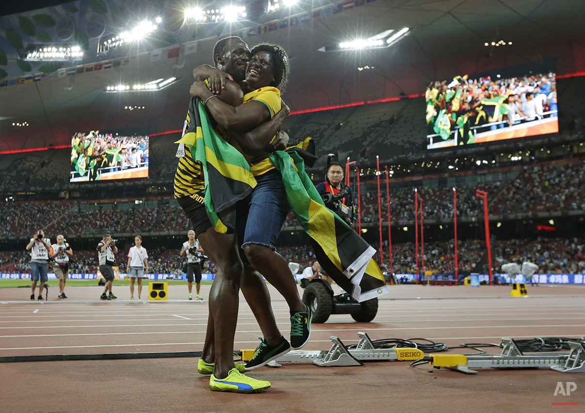  Jamaica's Usain Bolt hugs his mom, Jennifer Bolt, after winning the men’s 100m final at theWorld Athletics Championships at the Bird's Nest stadium in Beijing, Sunday, Aug. 23, 2015. (AP Photo/David J. Phillip) 