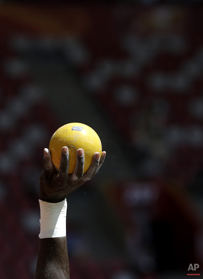  Grenada's Kurt Felix holds up his shot as he competes in the men's shot put decathlon at the World Athletics Championships at the Bird's Nest stadium in Beijing, Friday, Aug. 28, 2015. (AP Photo/Lee Jin-man) 