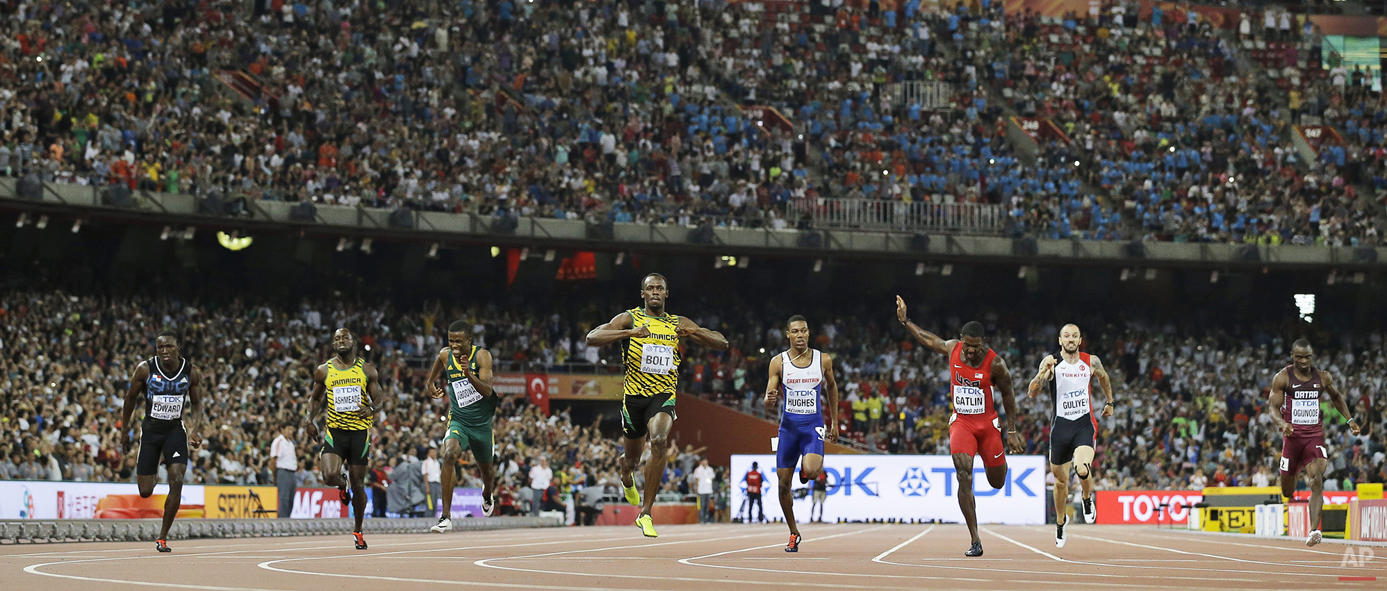  Jamaica's Usain Bolt, middle, celebrates after winning the men’s 200m final at the World Athletics Championships at the Bird's Nest stadium in Beijing, Thursday, Aug. 27, 2015. (AP Photo/David J. Phillip) 