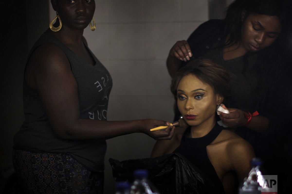  In this Sunday, Sept. 18, 2016 photo, Sahhara, from Nigeria, is made up by friends ahead of the Miss Trans Star International 2016 celebrated in Barcelona, Spain. To be eligible to compete, contestants are not required to have undergone gender reass