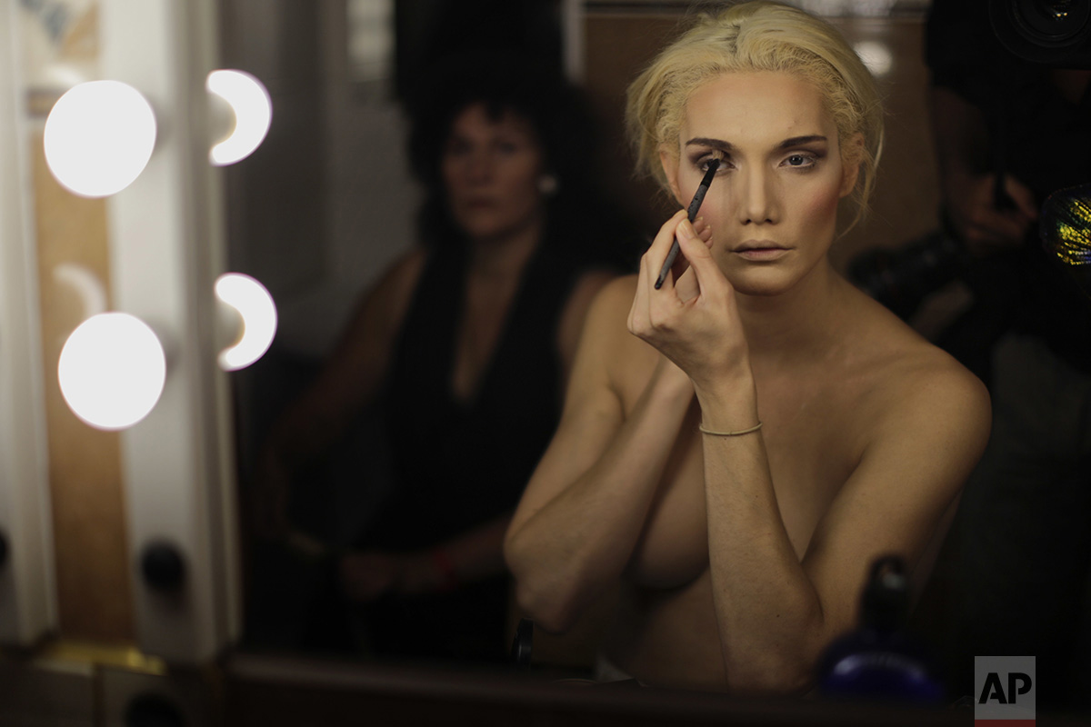  In this Sunday, Sept. 18, 2016 photo, Linni Rows Wiman, from Sweden, applies make up ahead of the Miss Trans Star International 2016 show celebrated in Barcelona, Spain. (AP Photo/Emilio Morenatti) 