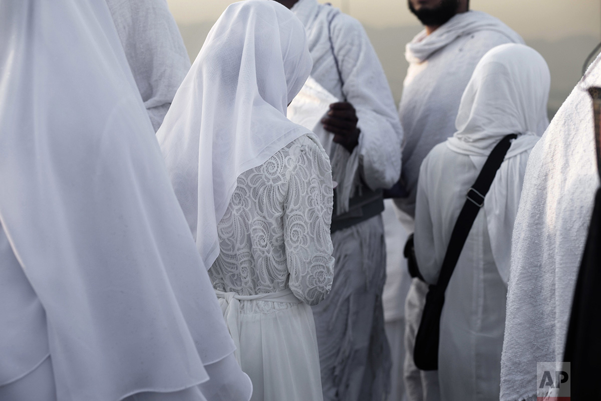  In this Sunday, Sept. 11, 2016 photo, Indonesian women make their way down after prayer on a rocky hill known as the Mountain of Mercy, on the Plain of Arafat, during the annual hajj pilgrimage, near the holy city of Mecca, Saudi Arabia. (AP Photo/N