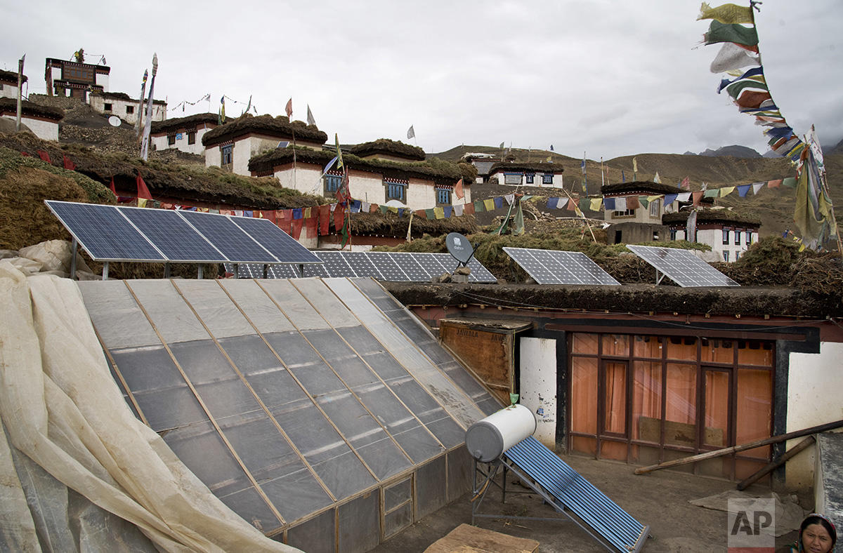  In this Aug. 17, 2016, photo, solar panels are installed on the rooftop of a traditional house in the mountain village of Demul, Spiti Valley, India. (AP Photo/Thomas Cytrynowicz) 