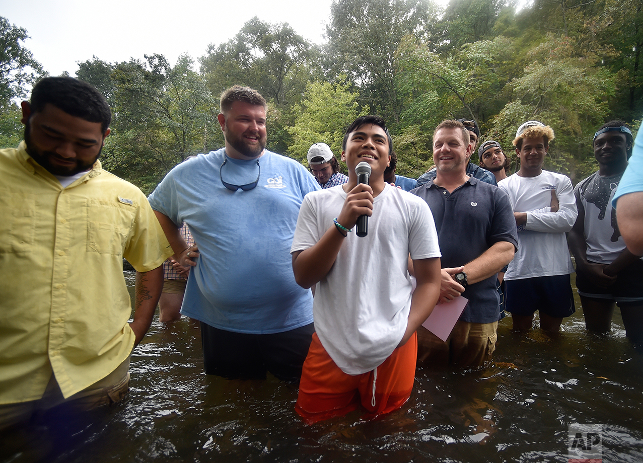  Habersham Central High School student and football player Ronald Butseecha speaks before being baptized in the Chattahoochee River, Sunday, Sept. 18, 2016, near Demorest, Ga. The ancient sacrament is memorialized in the Gospel account of John baptiz