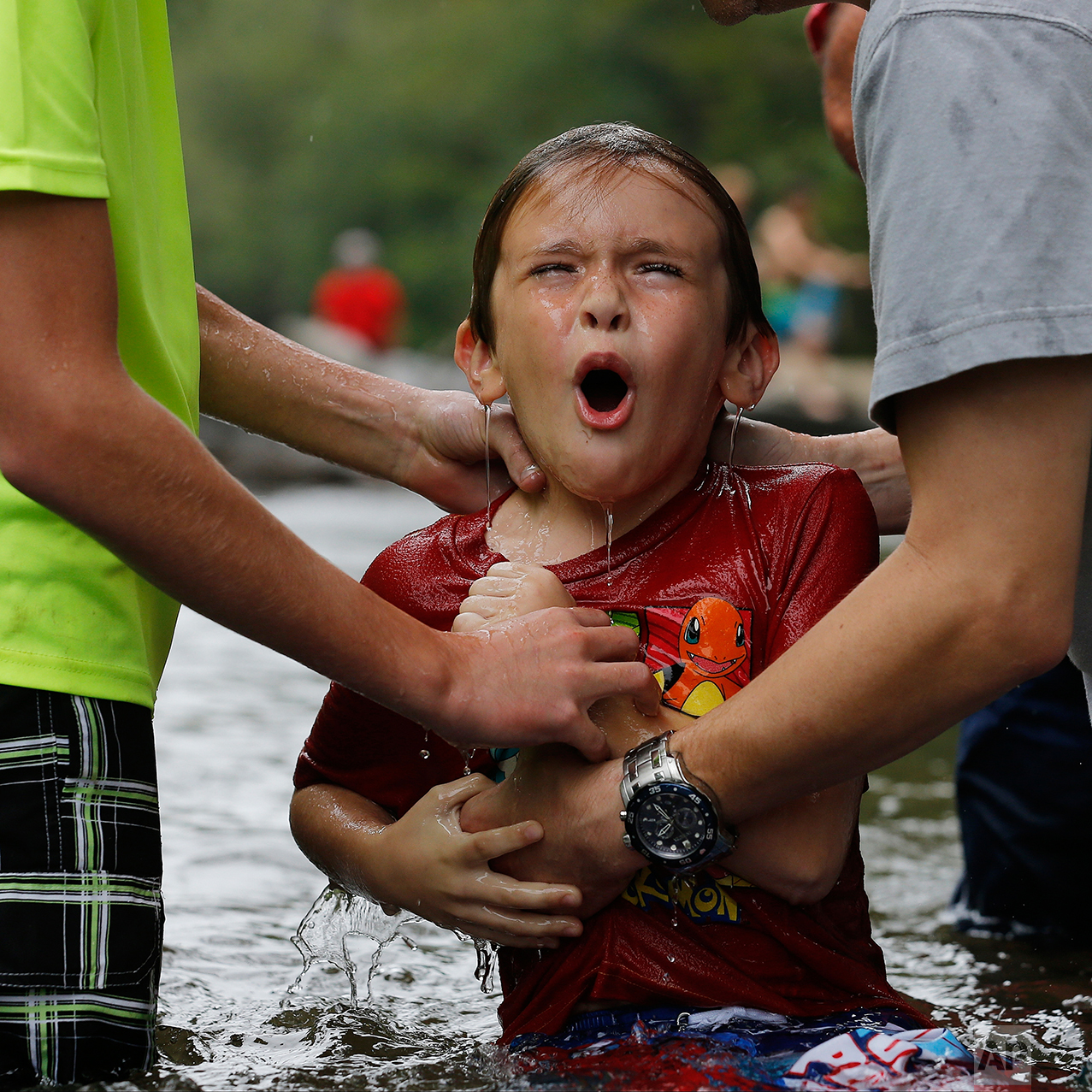  Nicholas Lewis reacts after he was baptized in the Chattahoochee River, Sunday, Sept. 18, 2016, near Demorest, Ga. Many denominations don’t fully immerse baptismal candidates, preferring to sprinkle them with water. And in churches that do immersion