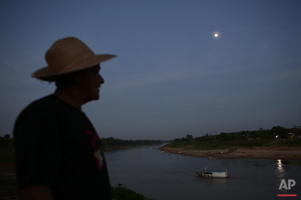  In this June 22, 2016 photo, a boatman gets ready to cross the Purus river near the city of Boca do Acre, Amazonas state, Brazil. The Purus river provides the main access to the community of Ceu do Mapia in a trip of more than four hours deep in the