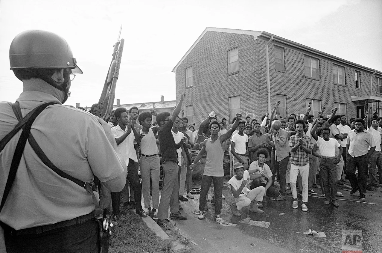 Police occupy the Black Panther headquarters in New Orleans following a shootout on Tuesday, Sept. 16, 1970. Seven persons were wounded and 14 others were arrested during the incident. (AP Photo)