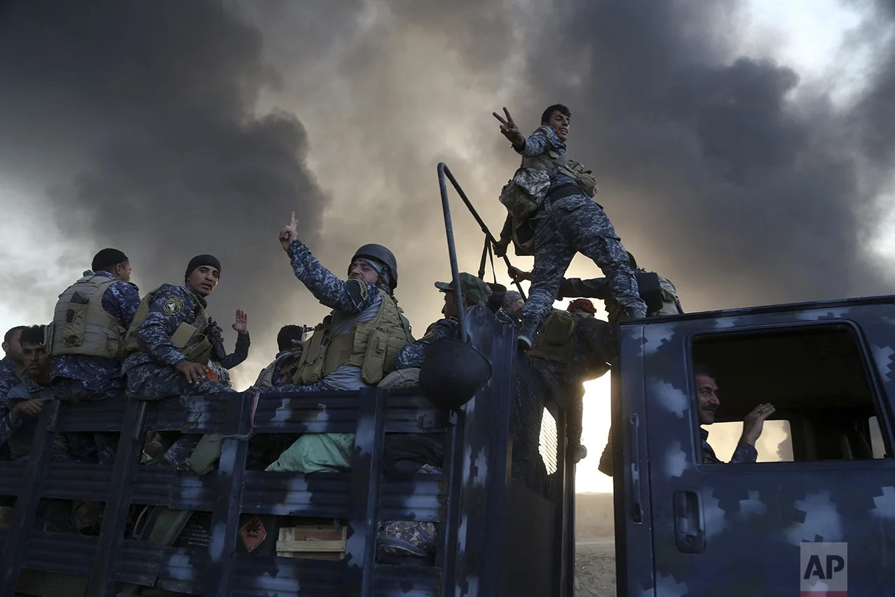 Smoke rises from Islamic state positions after an airstrike by coalition forces in Mosul, Iraq, Tuesday, Oct. 18, 2016. The pace of operations slowed on Tuesday as Iraqi forces began pushing toward larger villages and encountering civilian populations on the second day of a massive operation to retake the northern Iraqi city of Mosul from the Islamic State group. (AP Photo)