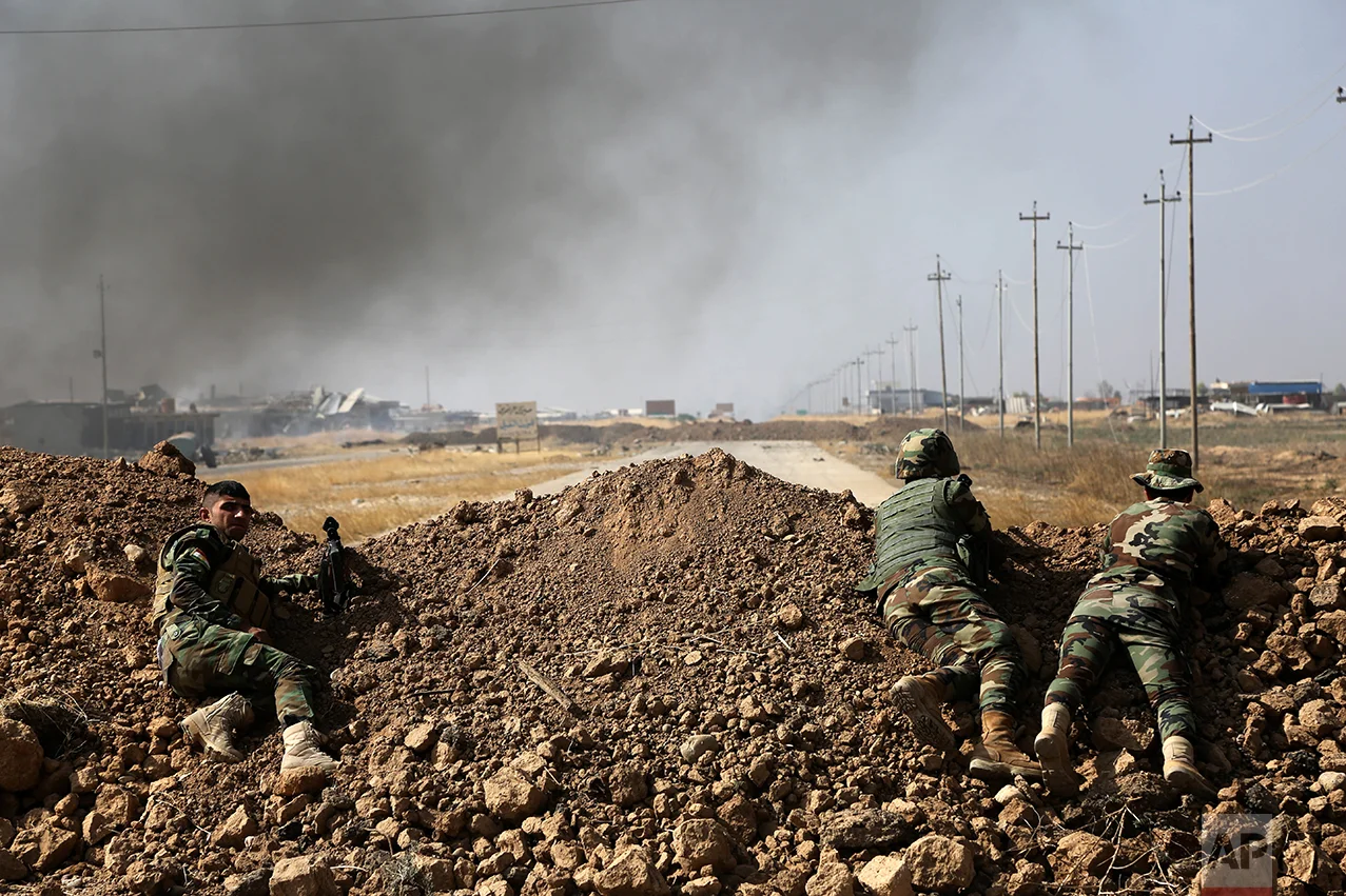 Kurdish security forces take up a position as they fight overlooking the Islamic State-controlled in villages surrounding Mosul, in Khazer, about 30 kilometers (19 miles) east of Mosul, Iraq, Monday, Oct. 17, 2016. Iraqi government and Kurdish forces, backed by U.S.-led coalition air and ground support, launched coordinated military operations early on Monday as the long-awaited fight to wrest the northern city of Mosul from Islamic State fighters got underway. (AP Photo)