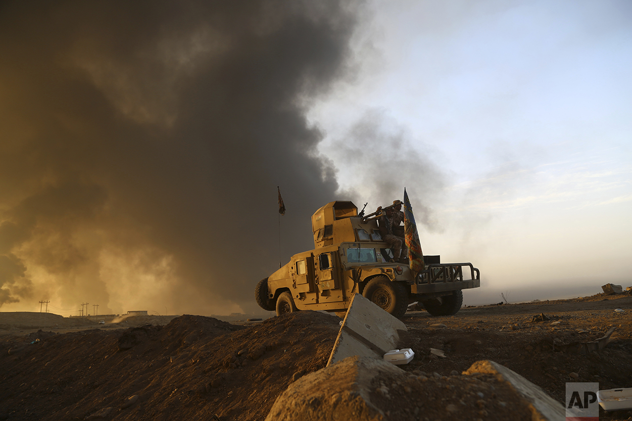 Smoke rises from Islamic state positions after an airstrike by coalition forces in Mosul, Iraq, Tuesday, Oct. 18, 2016. The pace of operations slowed on Tuesday as Iraqi forces began pushing toward larger villages and encountering civilian populations on the second day of a massive operation to retake the northern Iraqi city of Mosul from the Islamic State group. (AP Photo)
