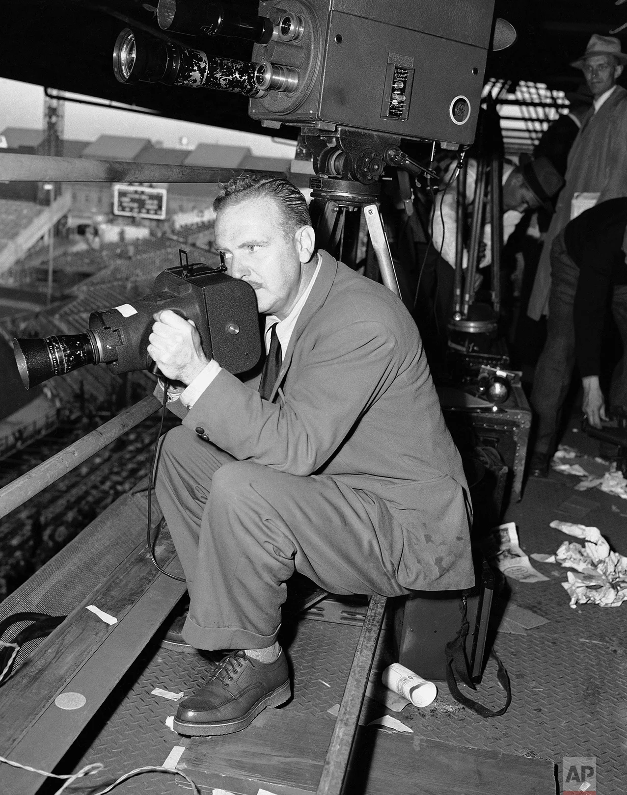 John Lindsay, New York Associated Press photographer, operates the K-25 camera during the second World Series game at Boston, Mass., Oct. 7, 1948. (AP Photo)