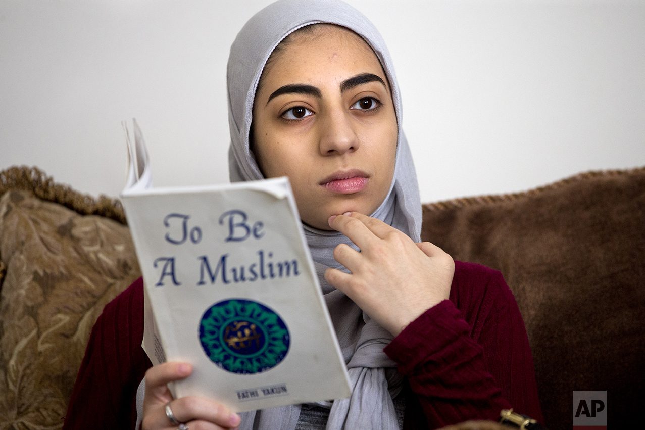 Hannah Shraim attends a study session of her youth group as part of the Muslim American Society of Maryland, in Germantown, Md., Saturday, May 7, 2016. The members of the youth group are also members of Girl Scout Troop 3797, a faith based troop. (AP Photo/Jacquelyn Martin)