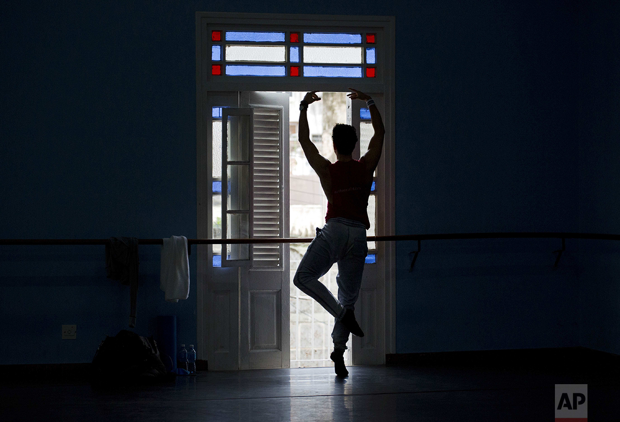 A ballet dancer performs during a class at the National Ballet of Cuba headquarters in Havana, Cuba, Friday, Oct. 28, 2016. The International Ballet Festival of Havana, held every two years, will take place Oct. 28 - Nov. 6, with 20 performances and several world premieres. (AP Photo/Ramon Espinosa)