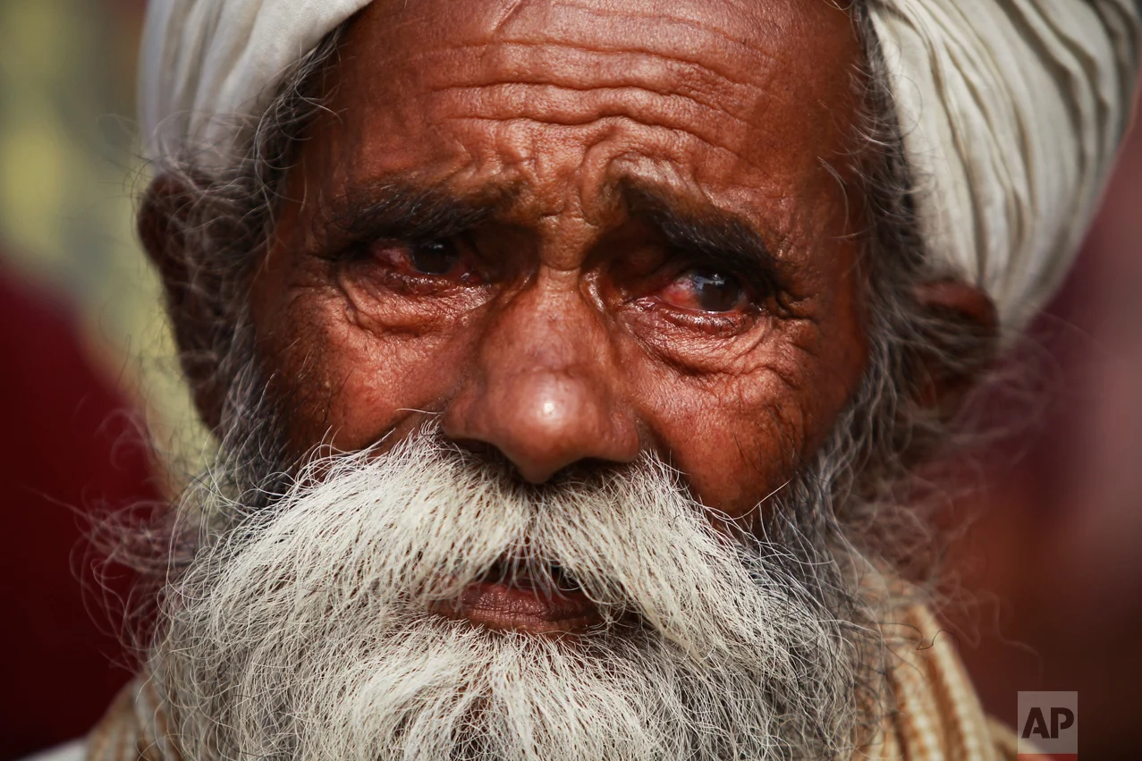 Father of Indian civilian Sawarn Singh who was killed in Pakistani shelling mourns outside a hospital in Ramgarh sector, Samba district of Jammu and Kashmir, India, Tuesday, Nov.1, 2016. Six civilians were killed and nine others wounded by Pakistani shelling in Kashmir on Tuesday, Indian officials said, as cross-border firing by the two countries' troops escalated in the disputed region. (AP Photo/Channi Anand)