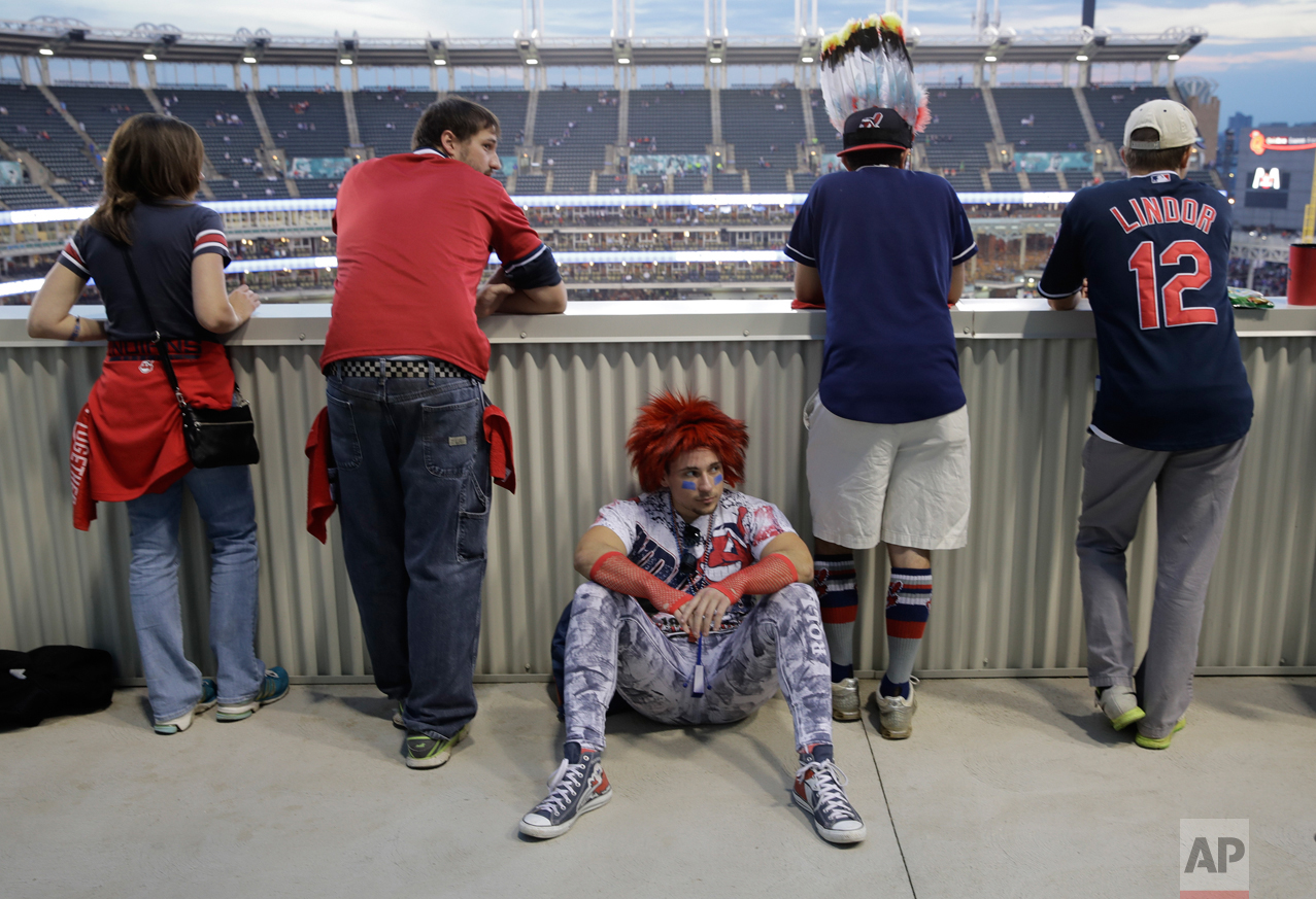  Cleveland Indian fans watch batting practice before Game 7 of the Major League Baseball World Series against the Chicago Cubs Wednesday, Nov. 2, 2016, in Cleveland. (AP Photo/Charlie Riedel) 