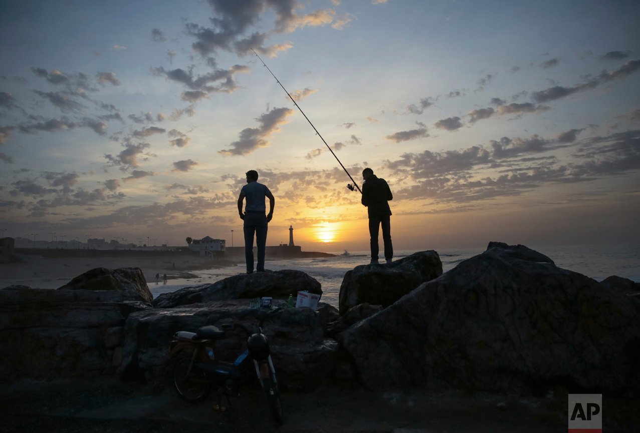  Fishermen wait for a catch on Rabat beach, Morocco, on Wednesday, Nov. 2, 2016. Rabat beach is a hub for families, couples and fitness enthusiasts especially on temperate days.  (AP Photo/Mosa'ab Elshamy) 