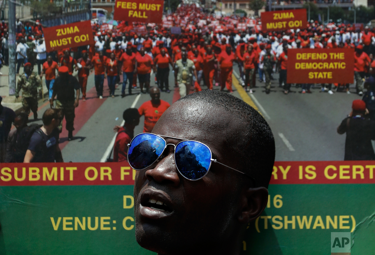  A member of the Economic Freedom Fighters (EFF) holds a placard during an anti-government march in Pretoria, South Africa, Wednesday, Nov. 2, 2016. Thousands of South Africans are demonstrating for the resignation of President Jacob Zuma, who has be