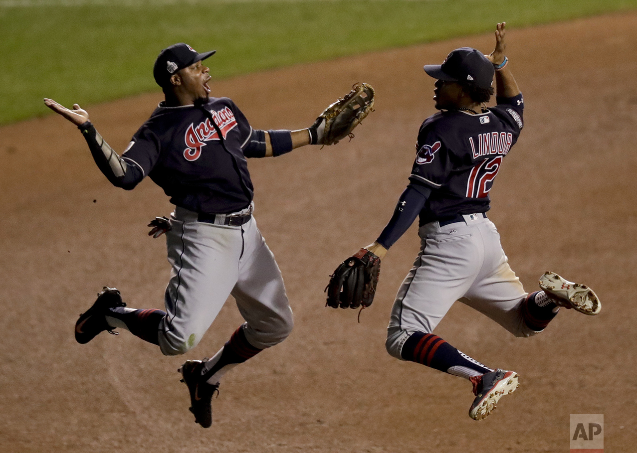  Cleveland Indians left fielder Rajai Davis, left, and shortstop Francisco Lindor celebrate their win after Game 4 of the Major League Baseball World Series against the Chicago Cubs, Saturday, Oct. 29, 2016, in Chicago. After seven games, the Cubs wo