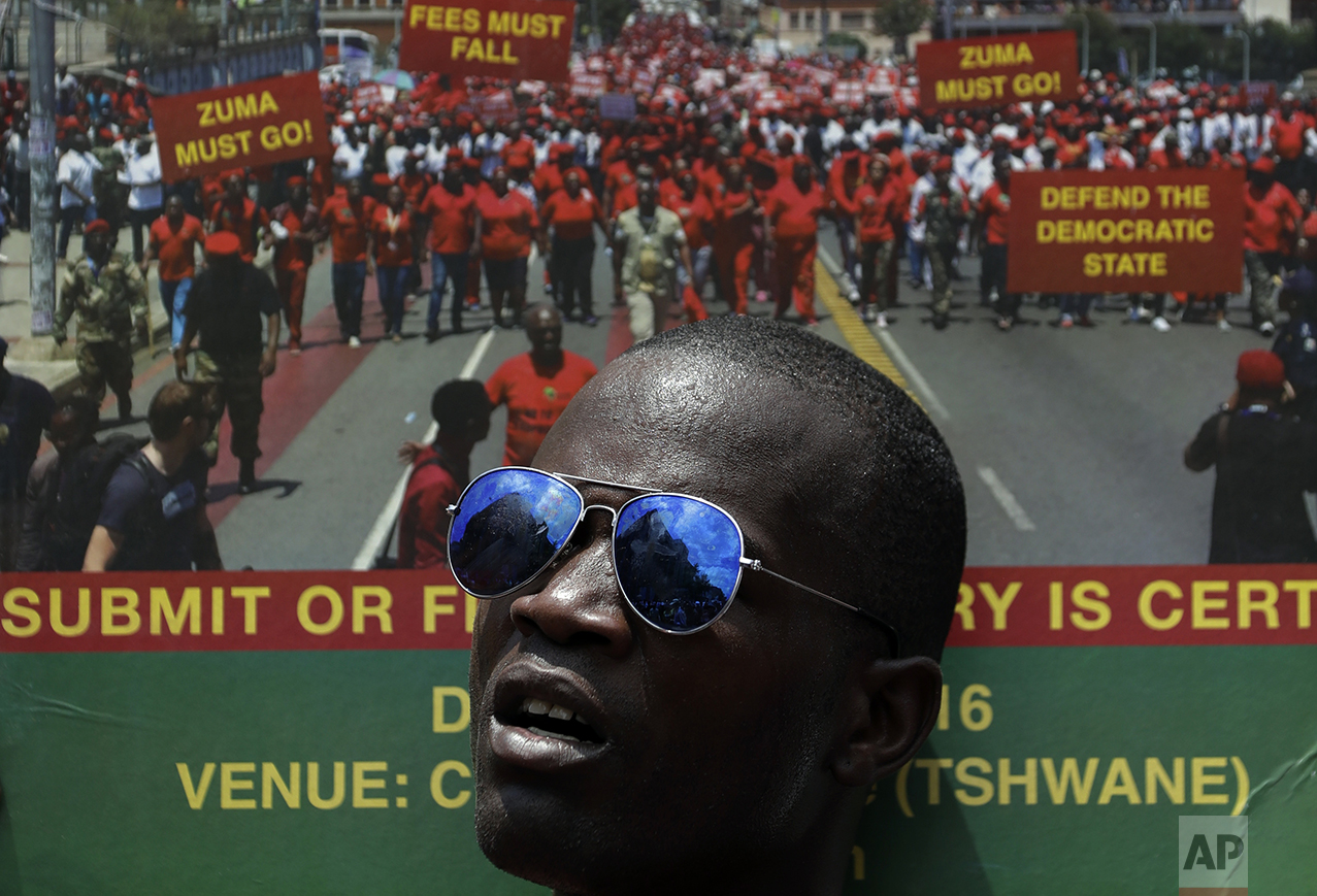  A member of the Economic Freedom Fighters (EFF) holds a placard during an anti-government march in Pretoria, South Africa, Wednesday, Nov. 2, 2016. Thousands are calling for the resignation of President Jacob Zuma, who has been enmeshed in scandals 