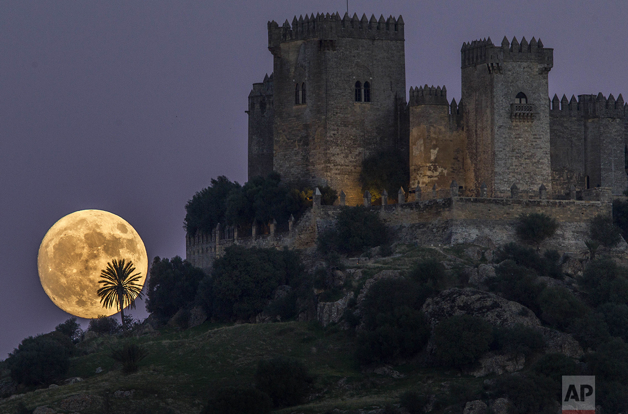 The moon rises behind the castle of Almodovar in Cordoba, southern Spain, on Sunday, Nov. 13, 2016. The Supermoon on Nov. 14, 2016, will be the closest a full moon has been to Earth since Jan. 26, 1948. (AP Photo/Miguel Morenatti)