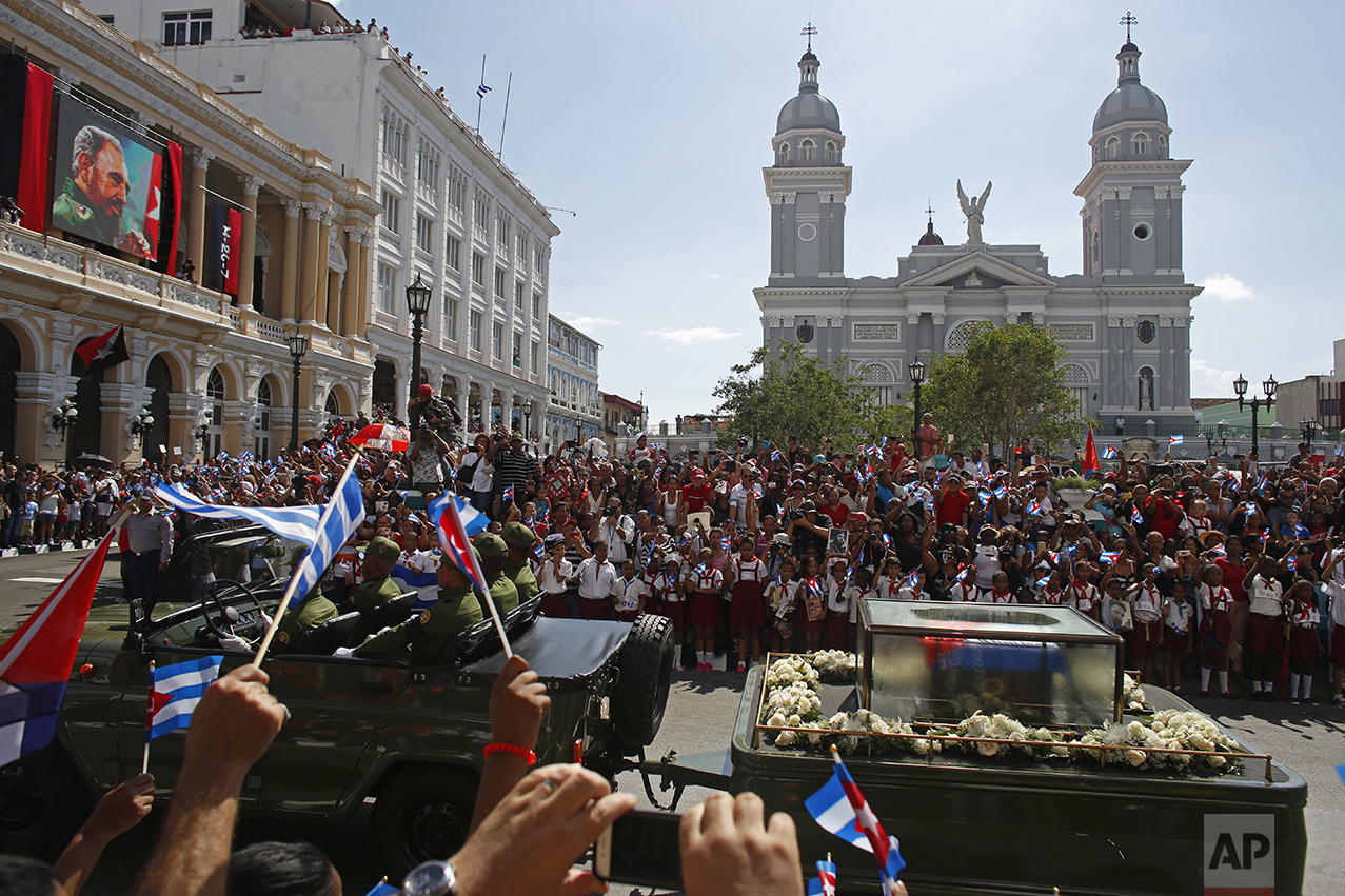  People chant "I am Fidel!" as the motorcade carrying the ashes of the late Cuban leader Fidel Castro leaves Cespedes Park in Santiago, Cuba, on Dec. 3, 2016. After days of national mourning and a tour of his ashes through the countryside, his remain