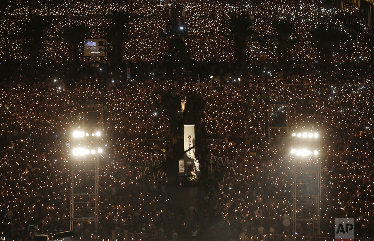  Tens of thousands of people attend a candlelight vigil at Victoria Park in Hong Kong on June 4, 2016, to commemorate victims of the 1989 military crackdown in Beijing. China's bloody 1989 military crackdown on the Tiananmen Square pro-democracy prot