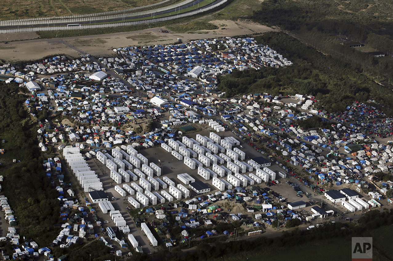  An aerial view shows a makeshift migrant camp near Calais, France, on Oct. 17, 2016. The French evacuated 6,400 migrants from the encampment in 170 buses, starting on Oct. 24, 2016, with the intent of resettling the migrants in different regions of 