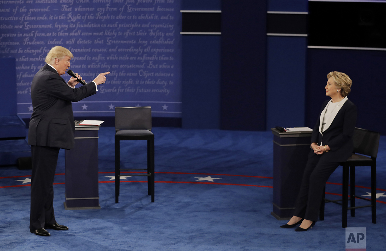  Republican presidential nominee Donald Trump speaks to Democratic presidential nominee Hillary Clinton during the second presidential debate at Washington University in St. Louis, on Oct. 9, 2016. (AP Photo/Patrick Semansky) 