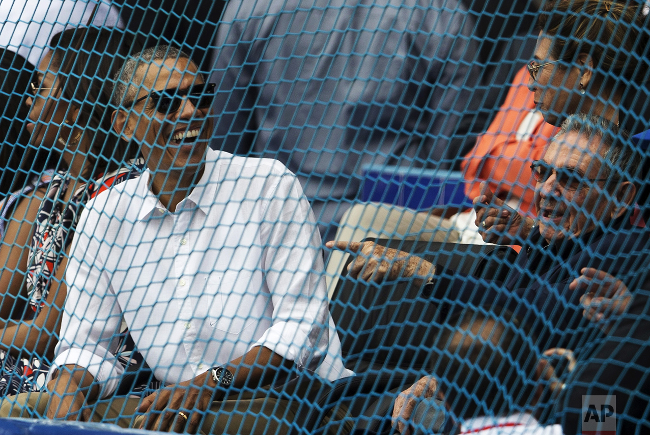  Cuban President Raul Castro, right, and U.S. President Barack Obama attend a baseball game between the Tampa Bay Rays and the Cuban national baseball team in Havana, Cuba, on March 22, 2016. The crowd roared as Obama and Castro entered the stadium a