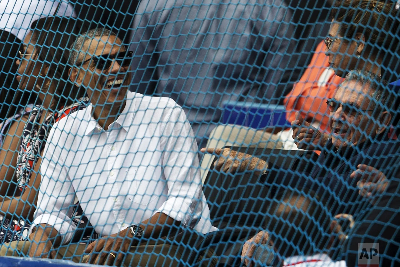 Cuban President Raul Castro, right, and U.S. President Barack Obama attend a baseball game between the Tampa Bay Rays and the Cuban national baseball team in Havana, Cuba, on March 22, 2016. The crowd roared as Obama and Castro entered the stadium and walked toward their seats in the VIP section behind home plate. It was the first game featuring an MLB team in Cuba since the Baltimore Orioles played in the country in 1999. (Ismael Francisco/Cubadebate via AP)