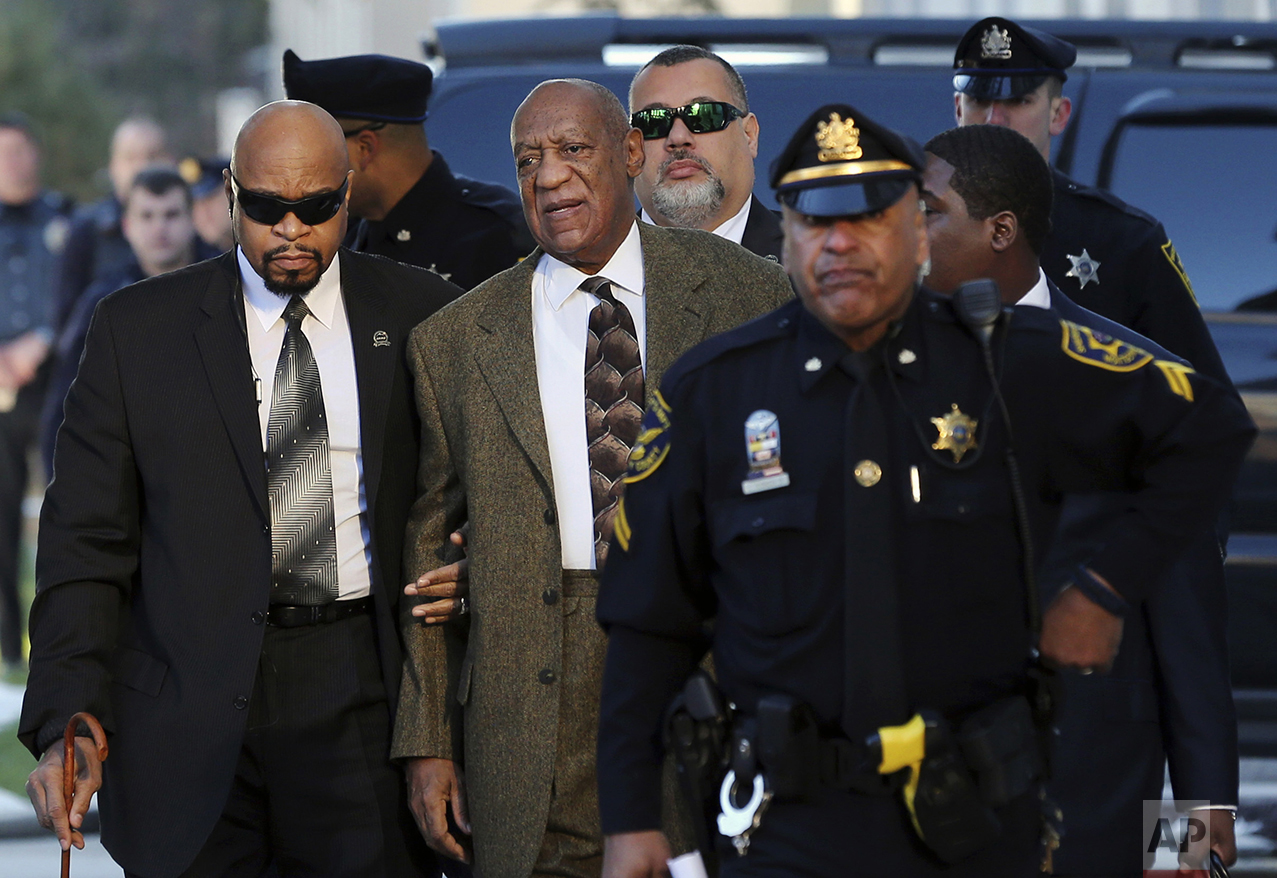  Actor and comedian Bill Cosby, center, arrives for a court appearance on Feb. 2, 2016, in Norristown, Pa. Cosby was arrested and charged with drugging and sexually assaulting a woman at his home in January 2004. (AP Photo/Mel Evans) 