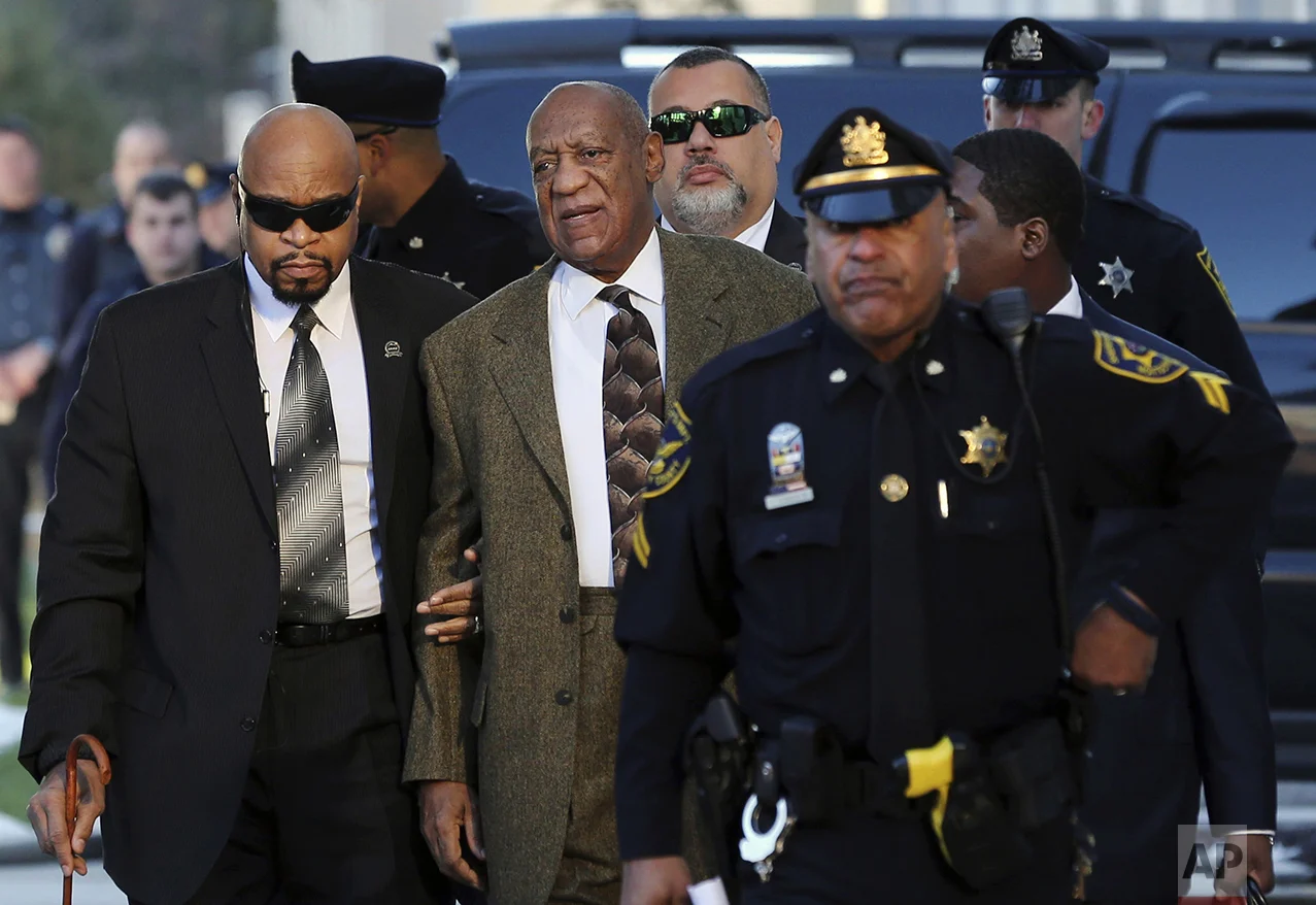 Actor and comedian Bill Cosby, center, arrives for a court appearance on Feb. 2, 2016, in Norristown, Pa. Cosby was arrested and charged with drugging and sexually assaulting a woman at his home in January 2004. (AP Photo/Mel Evans)