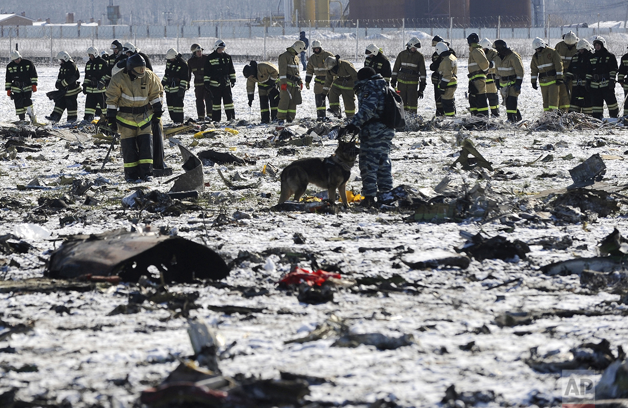  Russian Police and Emergency Ministry employees investigate the wreckage of a crashed plane at the Rostov-on-Don airport, about 950 kilometers (600 miles) south of Moscow, Russia, on March 20, 2016. (AP Photo) 