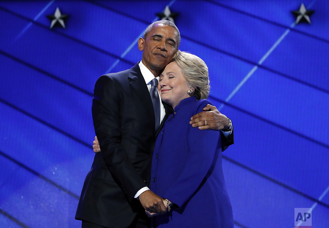  President Barack Obama hugs Democratic Presidential candidate Hillary Clinton after addressing the delegates during the third day session of the Democratic National Convention in Philadelphia, on July 27, 2016. (AP Photo/Carolyn Kaster) 