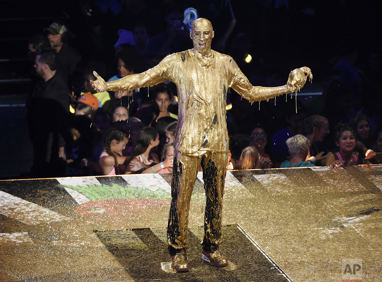  Retired NBA basketball player and Legend Award recipient Kobe Bryant poses after being "slimed" onstage during the 2016 Kids' Choice Sports Awards at Pauley Pavilion on July 14, 2016, in Los Angeles. (Photo by Chris Pizzello/Invision/AP) 