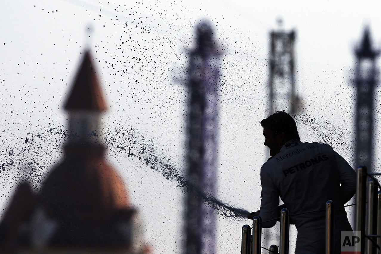  German Mercedes driver Nico Rosberg sprays champagne after winning the Formula One Russian Grand Prix at the Sochi Autodrom racetrack in Sochi, Russia, on May 1, 2016. (AP Photo/Pavel Golovkin) 