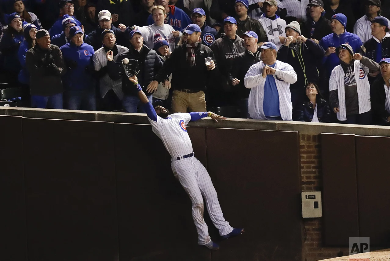 Chicago Cubs right fielder Jason Heyward catches a fly ball hit by Cleveland Indians' Trevor Bauer during the third inning of Game 5 of the Major League Baseball World Series on Oct. 30, 2016, in Chicago. (AP Photo/Charles Rex Arbogast)