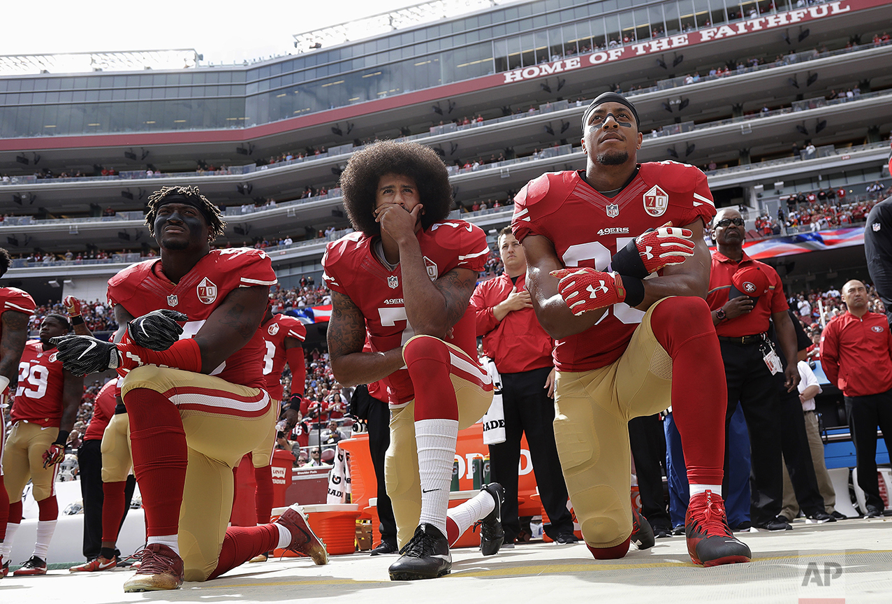  San Francisco 49ers outside linebacker Eli Harold, left, quarterback Colin Kaepernick, center, and safety Eric Reid kneel during the national anthem before an NFL football game against the Dallas Cowboys in Santa Clara, Calif., on Oct. 2, 2016. (AP 